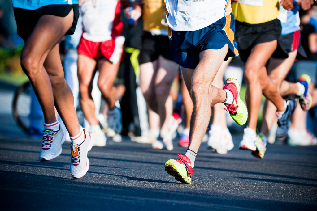 A group of people running on the street