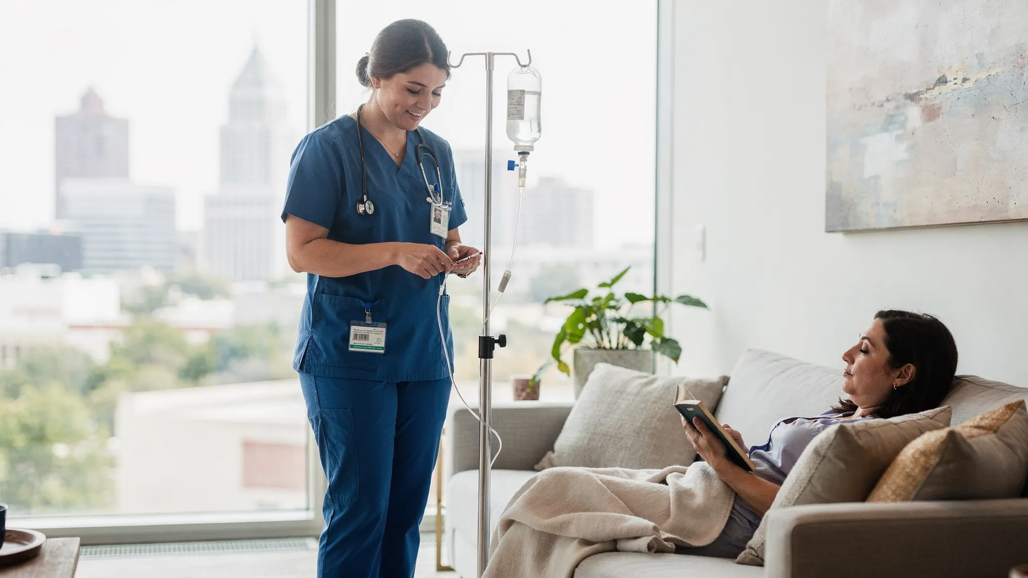 A registered nurse administering IV drip therapy to a client in a comfortable setting.
